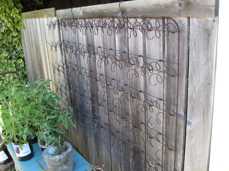 Use a Recycled Old Bed Spring as a Trellis