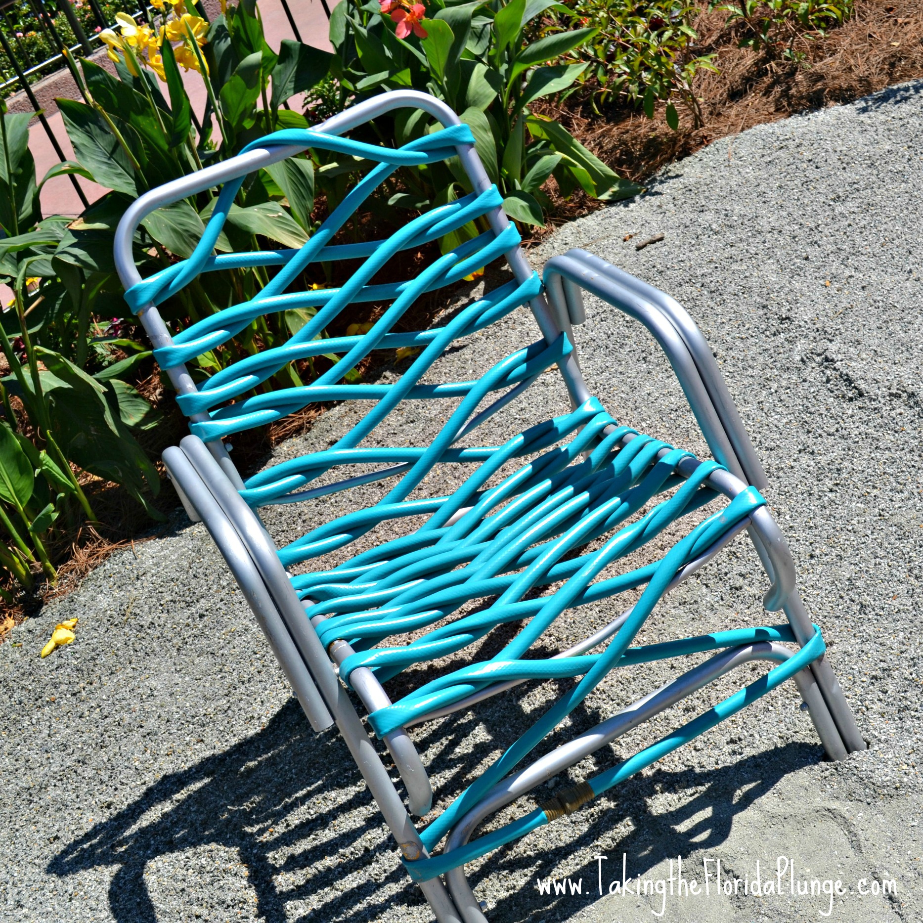 retro chair outfitted with a garden hose