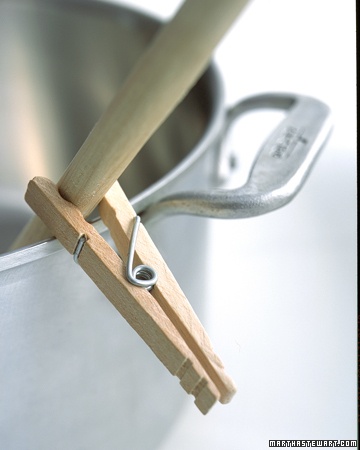 Clip a wooden clothespin to the spoon handle to keep the utensil from sliding into the pot