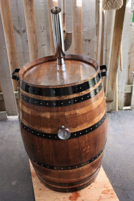 Turn an old whiskey barrel into fully functional charcoal BBQ smoker