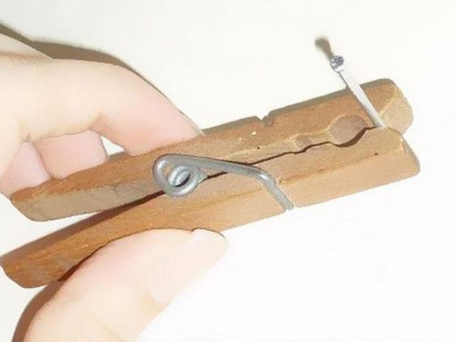 Use a clothespin to hold small nails when hammering them
